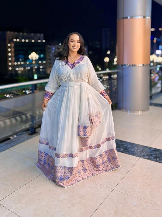 ሮዝ የሀበሻ ቀሚስ | ባህላዊነትን ከዘመናዊ ውበት ጋር የያዘ ልብስ