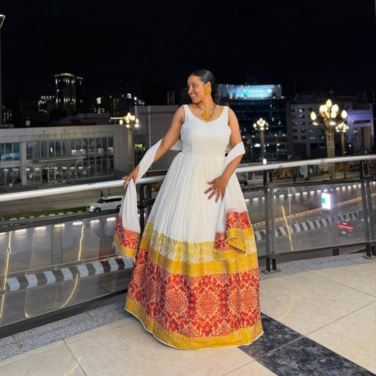 Red and Gold Habesha Kemis – Elegant White Traditional Ethiopian Dress with Vibrant Hand-Embroidered Borders for Special Events and Cultural Holidays