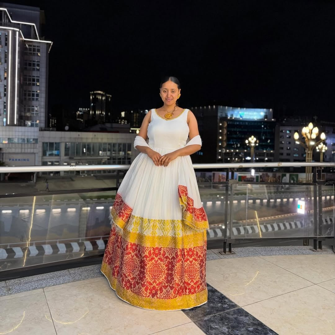 Red and Gold Habesha Kemis – Elegant White Traditional Ethiopian Dress with Vibrant Hand-Embroidered Borders for Special Events and Cultural Holidays