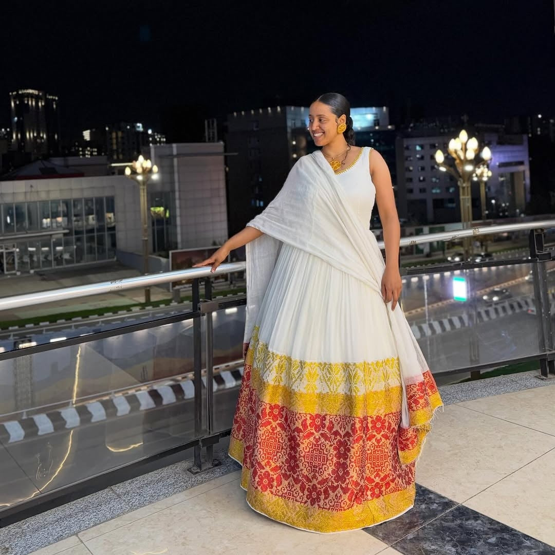 Red and Gold Habesha Kemis – Elegant White Traditional Ethiopian Dress with Vibrant Hand-Embroidered Borders for Special Events and Cultural Holidays