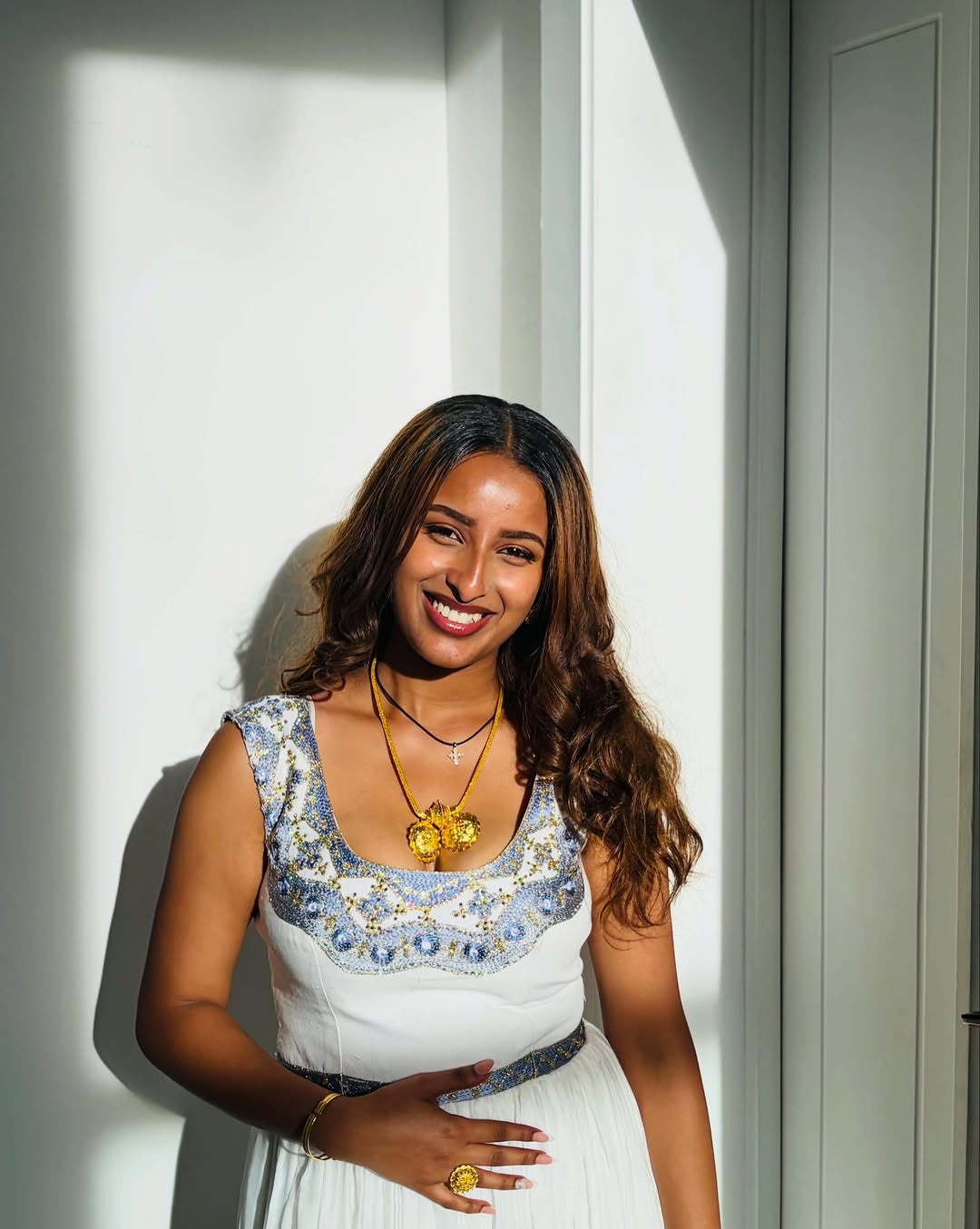 Elegant White Habesha Dress with blue Traditional Embroidery for Special Occasions