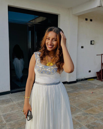 Elegant White Habesha Dress with blue Traditional Embroidery for Special Occasions