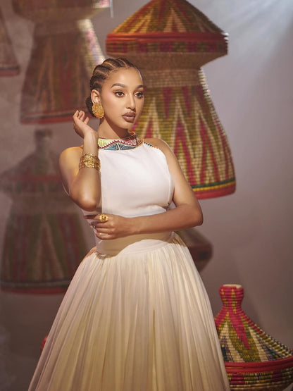 Woman in traditional attire with decorative background
