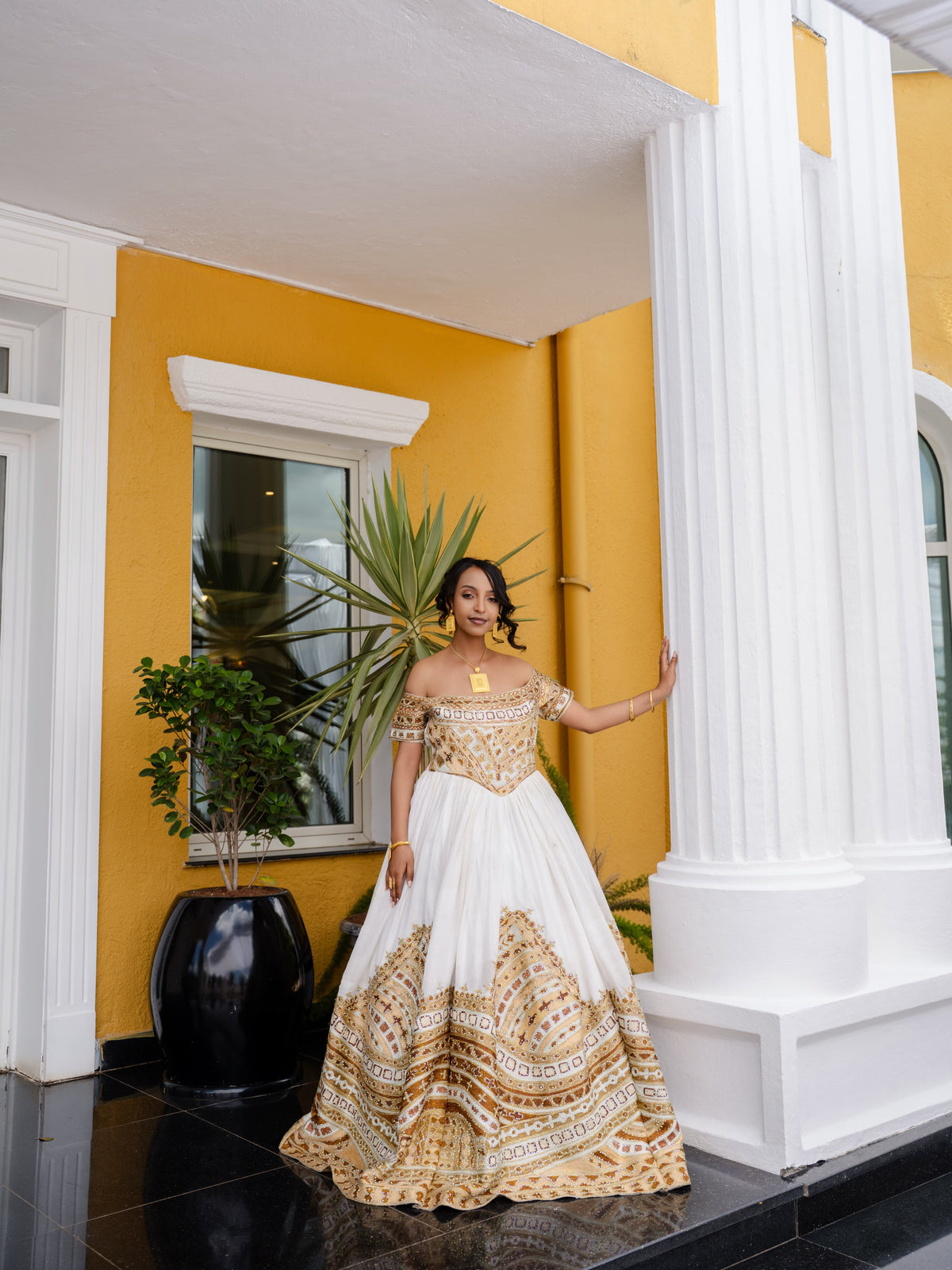 Gold Ethiopian national dresses for weddings with a calm refined color and traditional embroidery