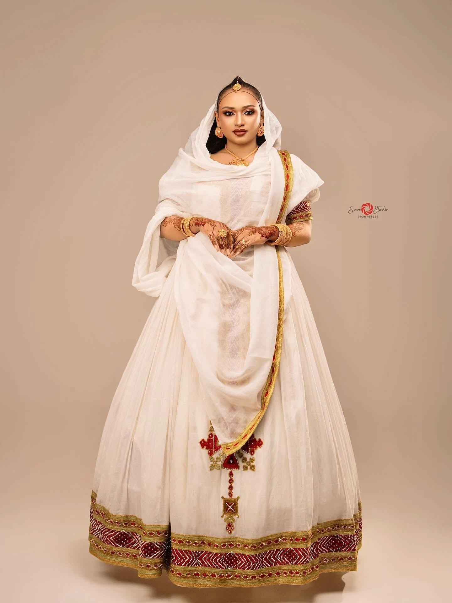 Red cotton Habesha kemis with gold embroidery for Fasika and Easter family gatherings