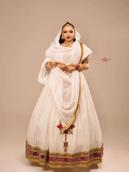 Red cotton Habesha kemis with gold embroidery for Fasika and Easter family gatherings