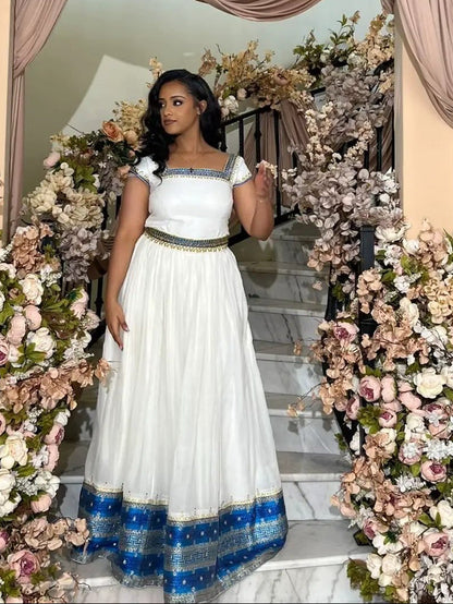 Blue Habesha Kemis – Graceful Handwoven Dress with Hand-Embroidered Tibeb Embroidery for Weddings