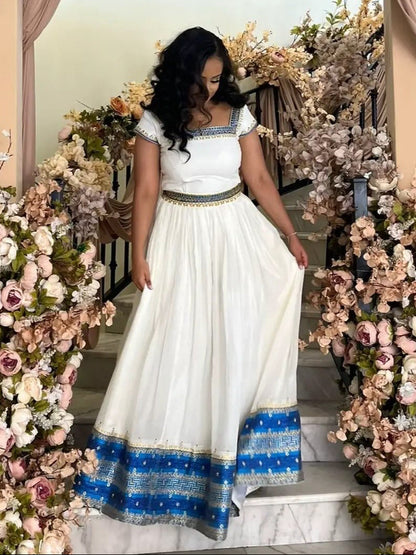 Blue Habesha Kemis – Graceful Handwoven Dress with Hand-Embroidered Tibeb Embroidery for Weddings
