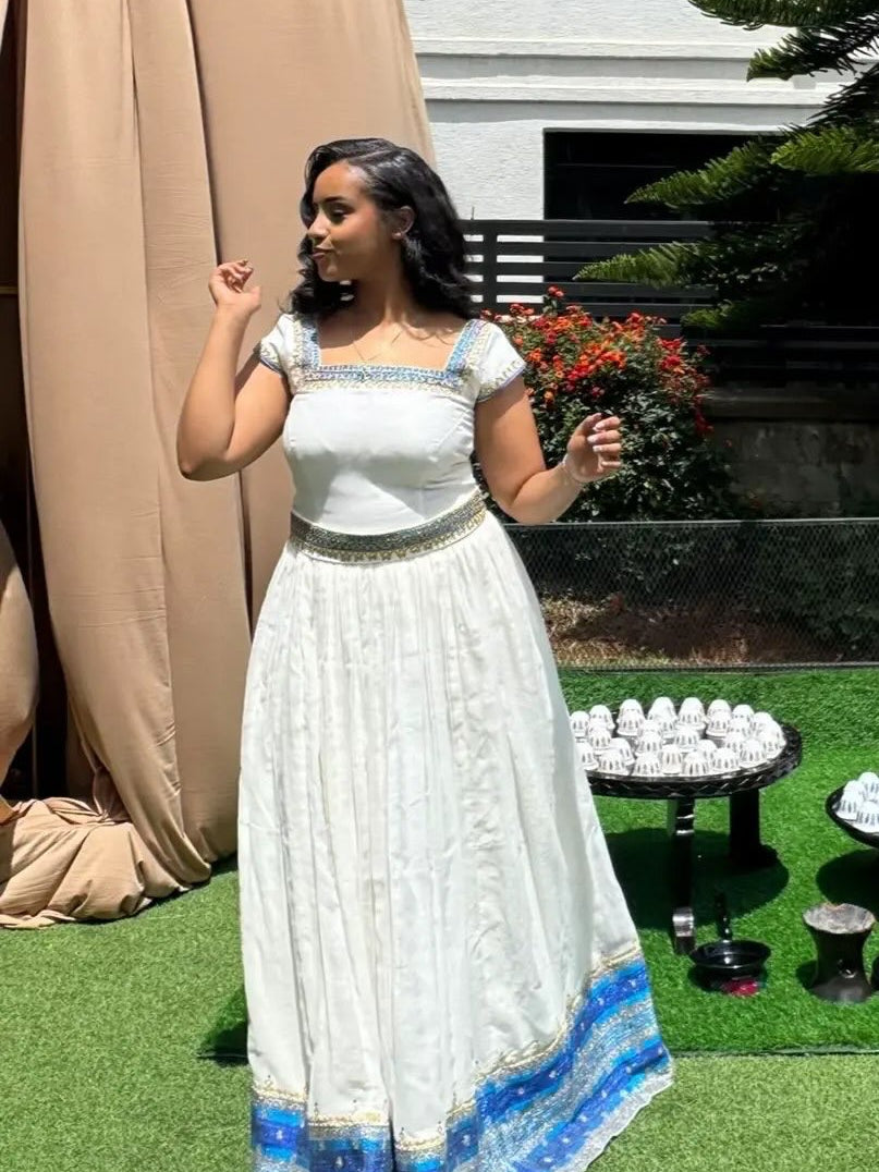 Blue Habesha Kemis – Graceful Handwoven Dress with Hand-Embroidered Tibeb Embroidery for Weddings