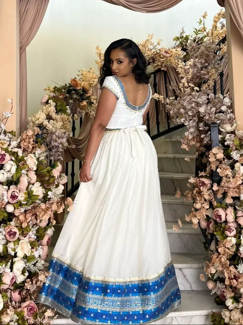 Blue Habesha Kemis – Graceful Handwoven Dress with Hand-Embroidered Tibeb Embroidery for Weddings