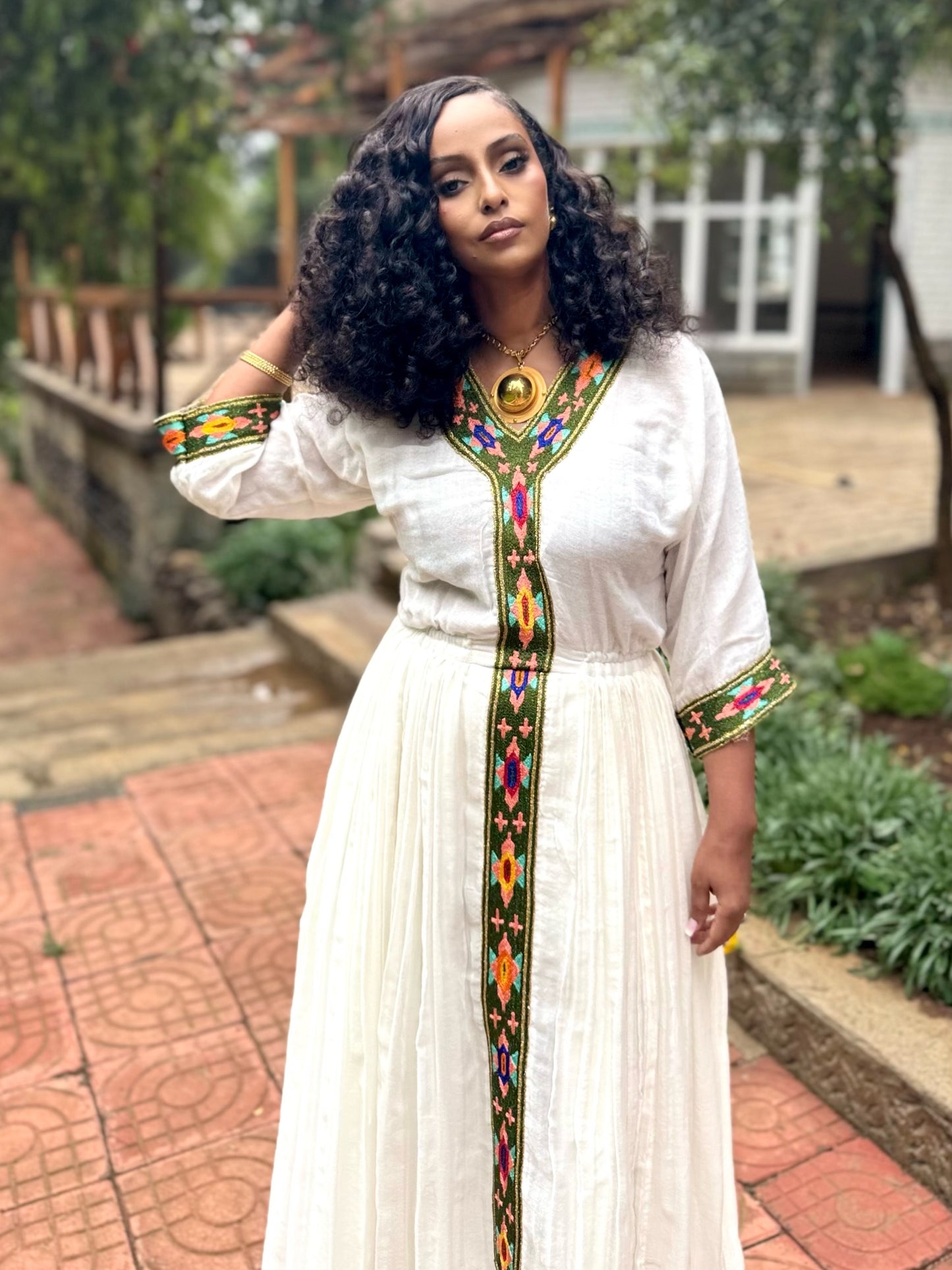 Forest Green Habesha zuria in handwoven cotton featuring silver tibeb embroidery for Fasika gatherings