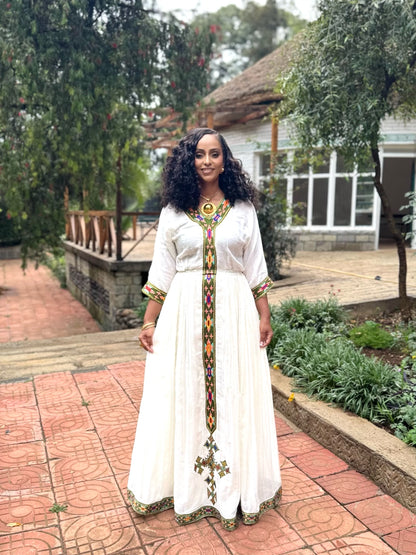 Forest Green Habesha zuria in handwoven cotton featuring silver tibeb embroidery for Fasika gatherings