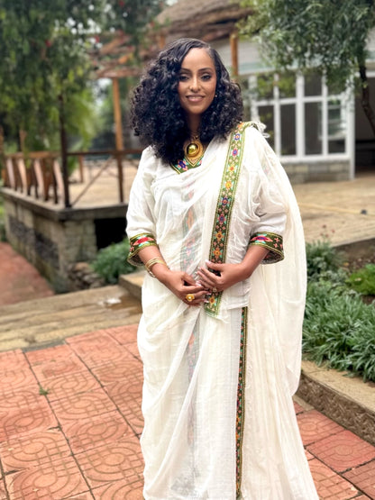 Forest Green Habesha zuria in handwoven cotton featuring silver tibeb embroidery for Fasika gatherings