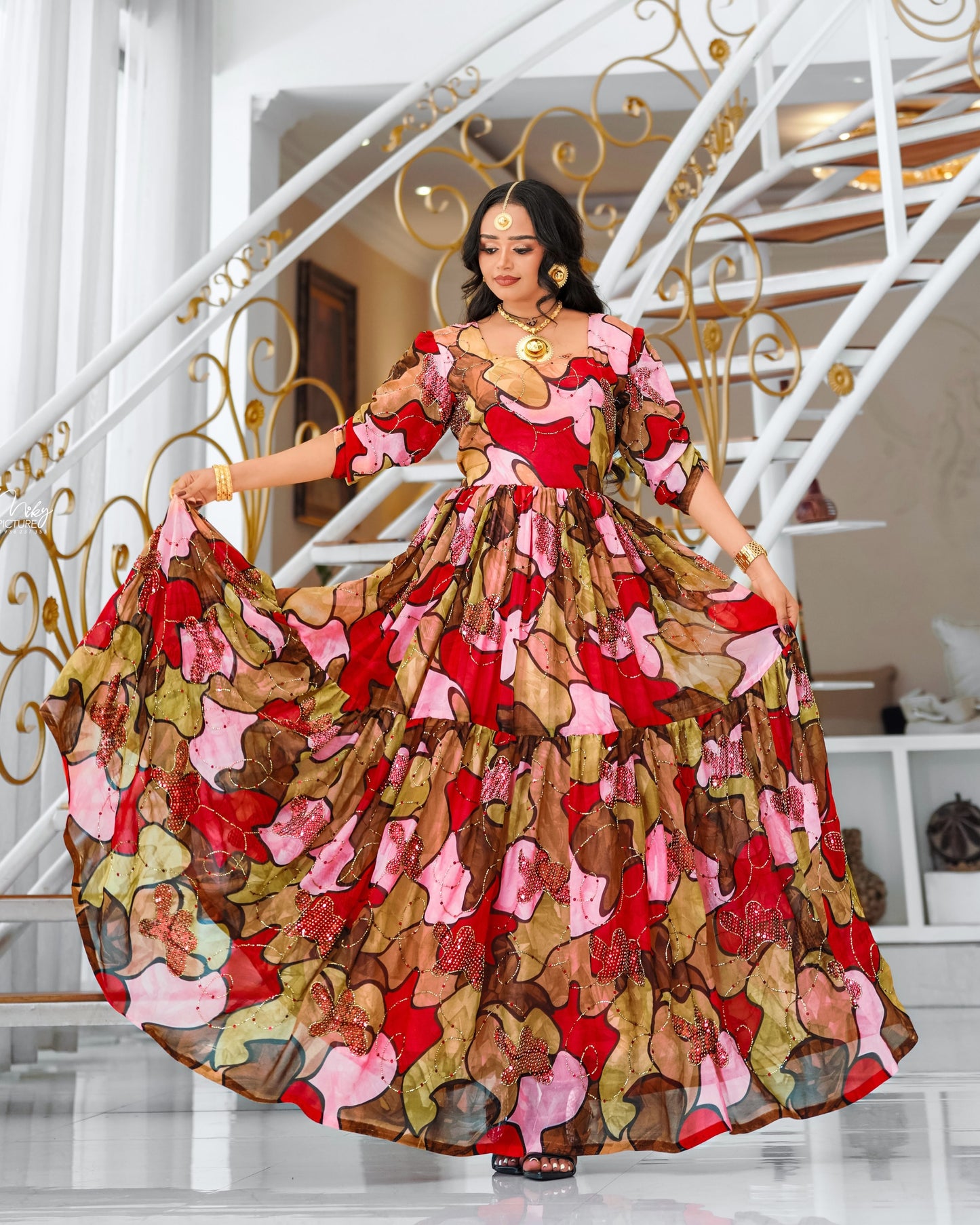 Multicolor Habesha chiffion in soft flowing featuring gold silk embroidery for Genna holiday gatherings