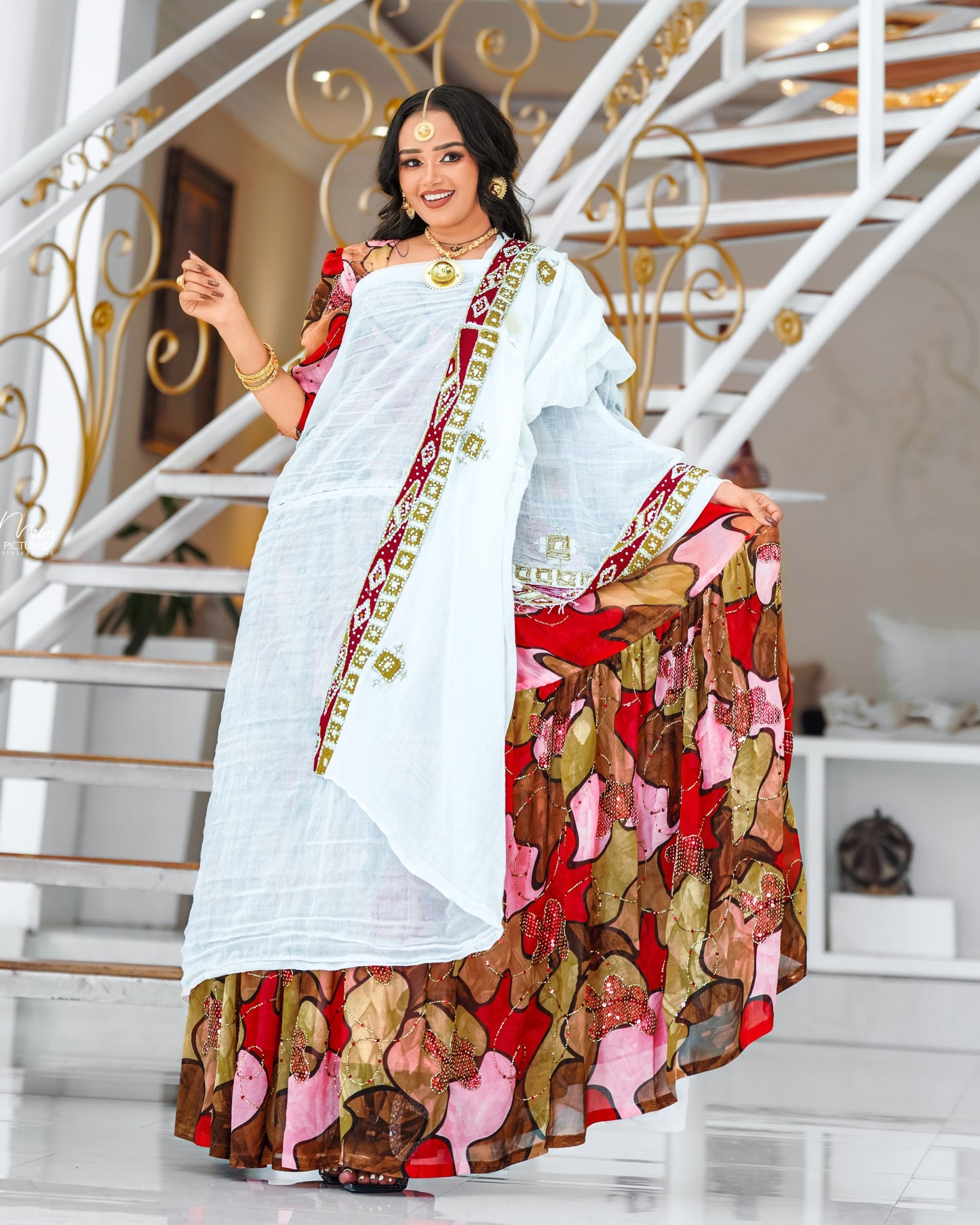 Multicolor Habesha chiffion in soft flowing featuring gold silk embroidery for Genna holiday gatherings