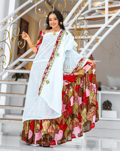 Multicolor Habesha chiffion in soft flowing featuring gold silk embroidery for Genna holiday gatherings