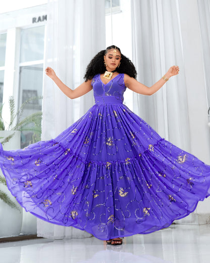 A woman wearing a voluminous purple sleeveless Habesha Dress with gold embroidered motifs, captured mid-spin as the skirt flares out in a bright indoor setting with white curtains.