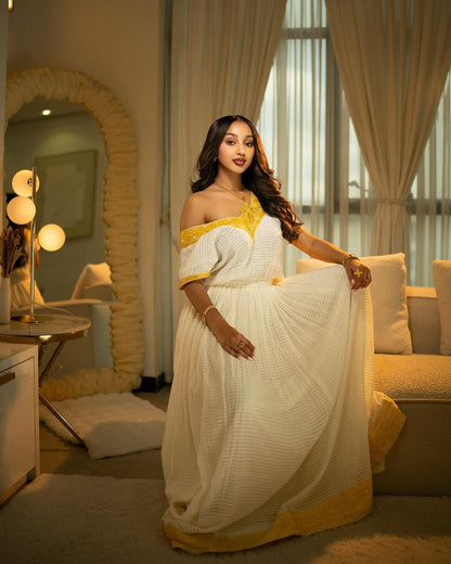 White & Yellow Habesha Kemis – Flowing Traditional Ethiopian wear by Tesfaye Mehari