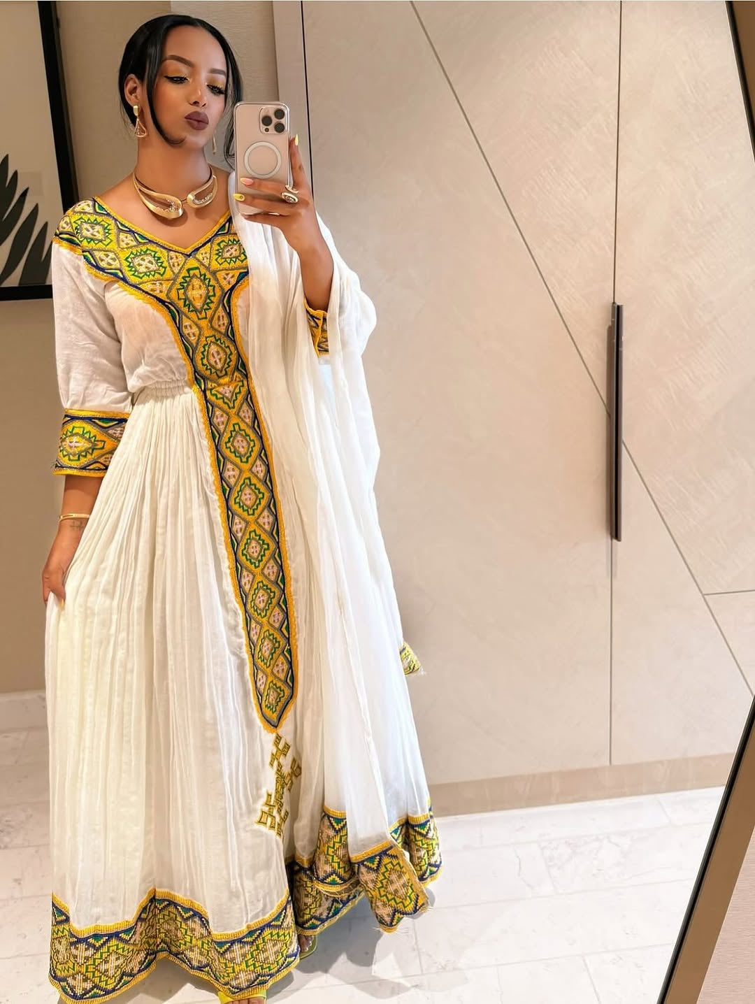 White Habesha Kemis with Gold Tibeb Design – Traditional Ethiopian Dress for Women by Tesfaye Mehari