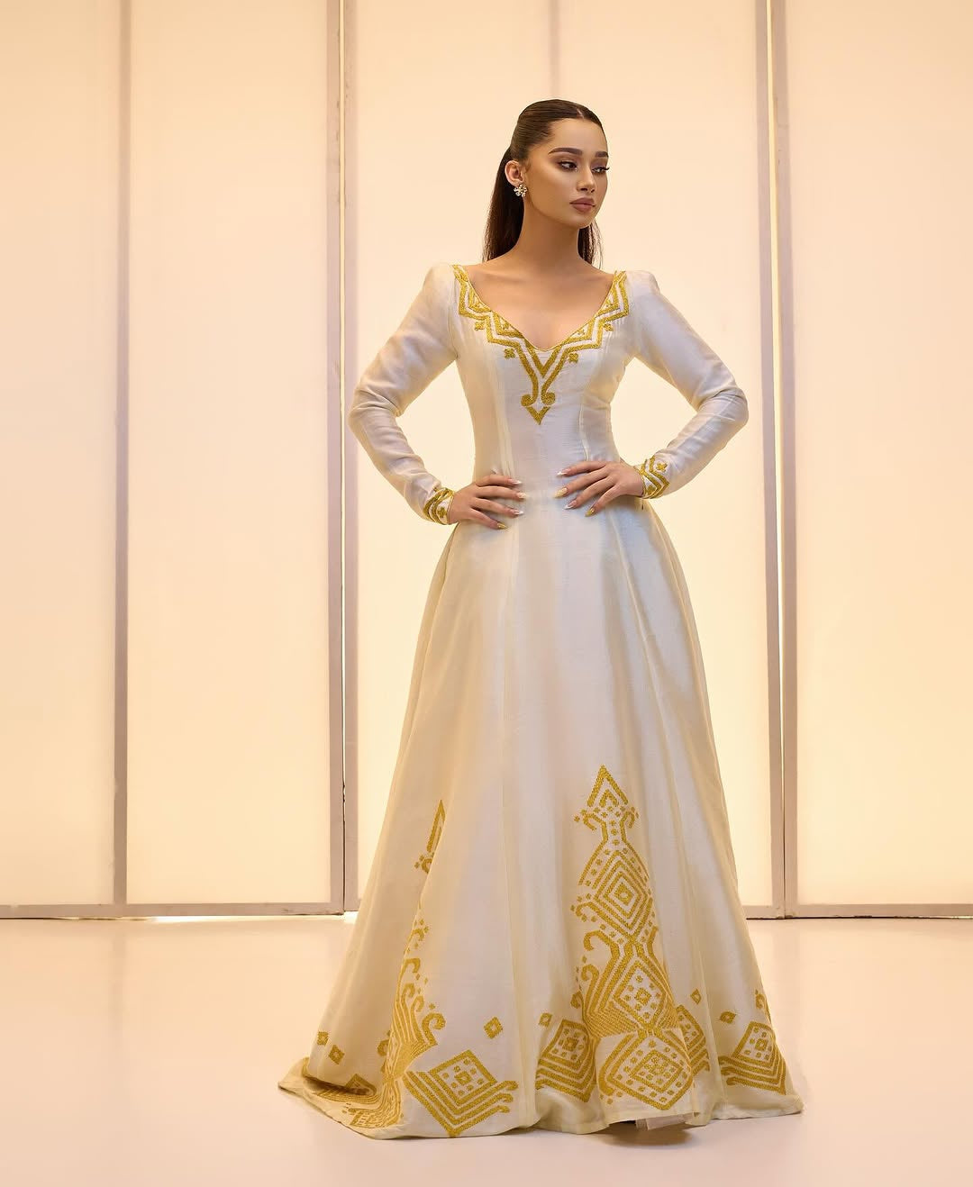 Elegant Golden bridal Kemis – Modern Full-Sleeve Ethiopian wedding dress by Tesfaye Mehari