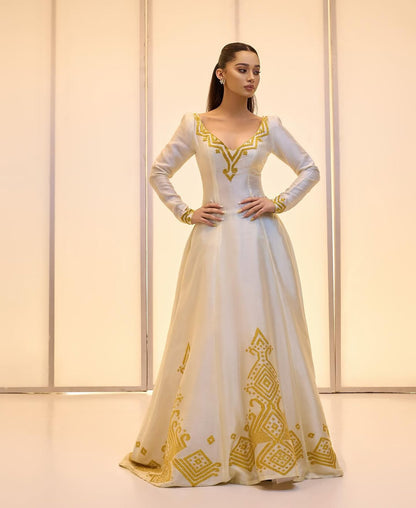 Elegant Golden bridal Kemis – Modern Full-Sleeve Ethiopian wedding dress by Tesfaye Mehari