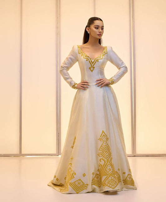Elegant Golden bridal Kemis – Modern Full-Sleeve Ethiopian wedding dress by Tesfaye Mehari