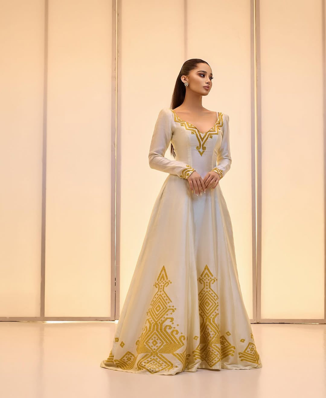 Elegant Golden bridal Kemis – Modern Full-Sleeve Ethiopian wedding dress by Tesfaye Mehari
