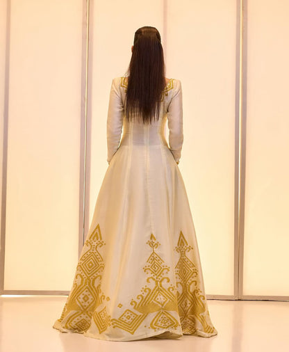 Elegant Golden bridal Kemis – Modern Full-Sleeve Ethiopian wedding dress by Tesfaye Mehari