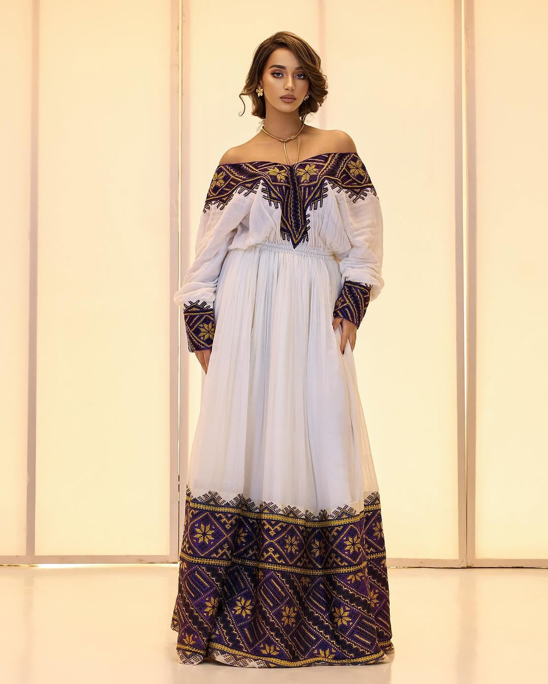 Off-the-Shoulder cultural Habesha Kemis by Tsehaye Mehari | Purple detailed Embroidery