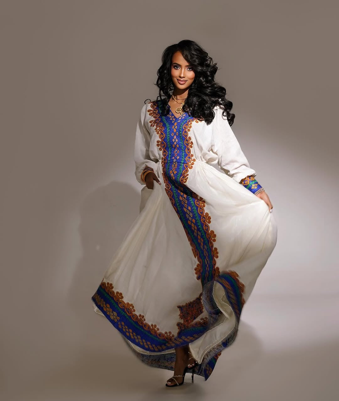 Elegant Habesha Kemis Featuring purple and Gold Traditional Tilet – Artisanal Ethiopian Cultural Dress