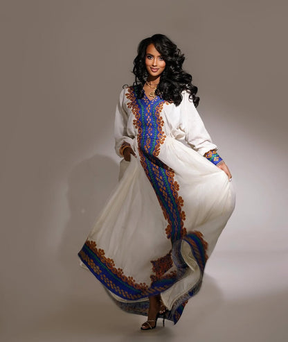 Elegant Habesha Kemis Featuring purple and Gold Traditional Tilet – Artisanal Ethiopian Cultural Dress