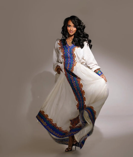 Elegant Habesha Kemis Featuring purple and Gold Traditional Tilet – Artisanal Ethiopian Cultural Dress
