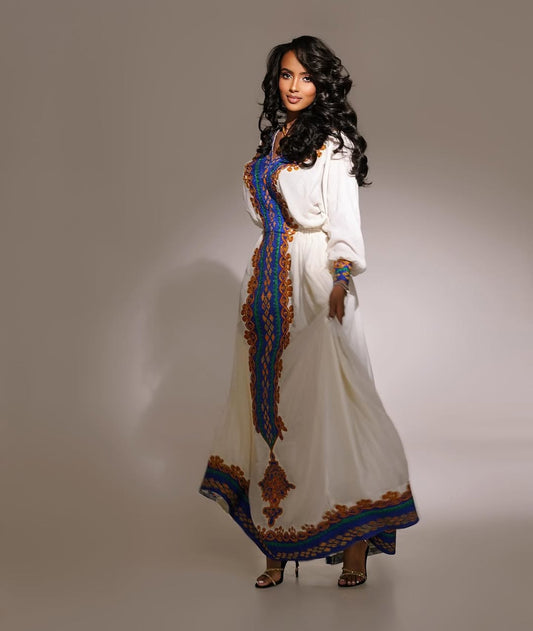 Elegant Habesha Kemis Featuring purple and Gold Traditional Tilet – Artisanal Ethiopian Cultural Dress